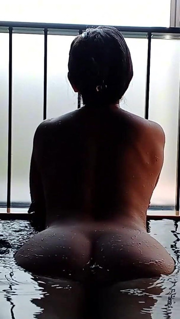 A Married Woman Taking a Bath in a Hotel Room